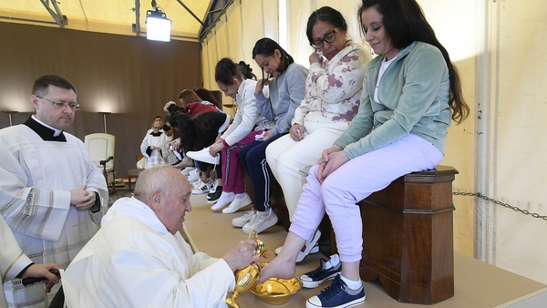 Seated in a wheelchair, the pope washed the feet of each of the prisoners, some of them in tears, before drying them off with a towel and kissing them
