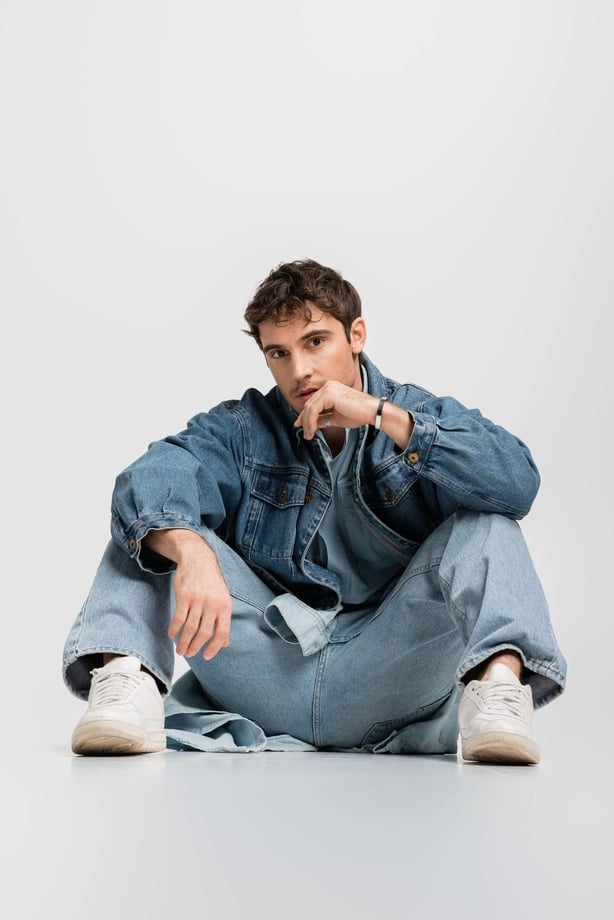 A man wearing double denim 