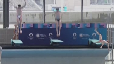 Diver slips during Olympic pool inauguration ceremony