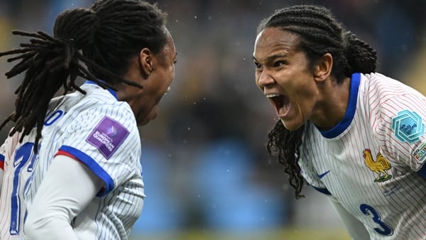 Wendie Renard (R) celebrates with France team-mate Marie-Antoinette Katoto