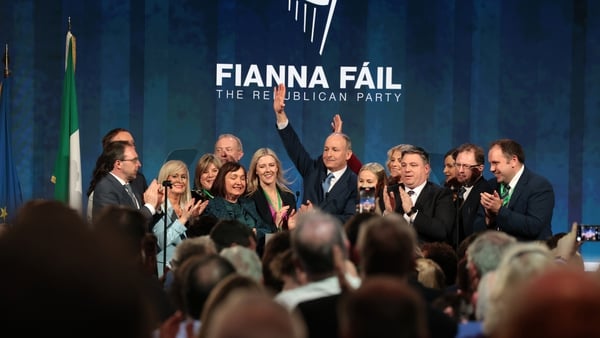 Tánaiste and Fianna Fáil leader Micheál Martin joined on stage by party members after his speech (pic: RollingNews.ie)
