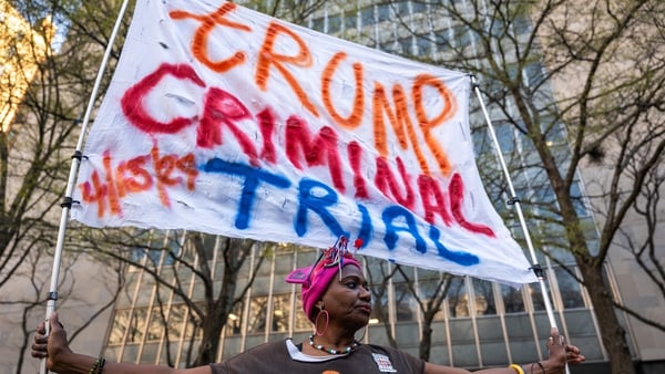 Nadine Seiler protests against Donald Trump outside the Manhattan Criminal Courthouse at the start of the trial