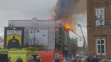Spire at Copenhagen's historic stock exchange building collpases due to fire