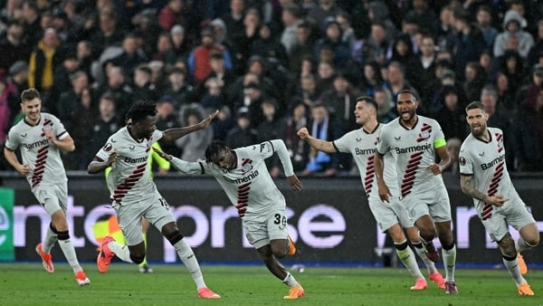 Jeremie Frimpong celebrates with team-mates after scoring the crucial goal for the German champions