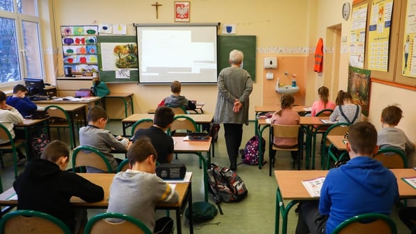 Pupils and their teacher at a primary school in Krakow (file pic)