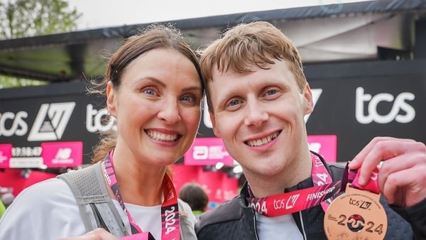 Emma Barton and Jamie Borthwick with their London Marathon medals