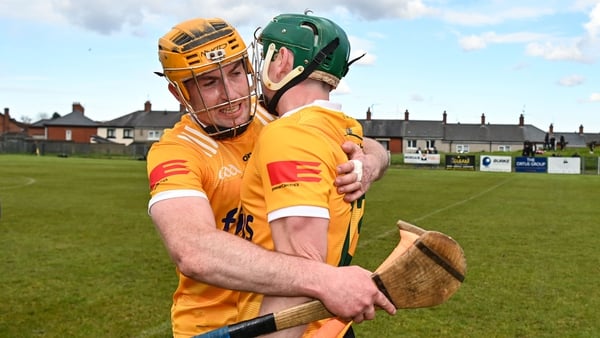 Antrim's Conor Boyd (L) celebrates with Conal Cunning at the final whistle