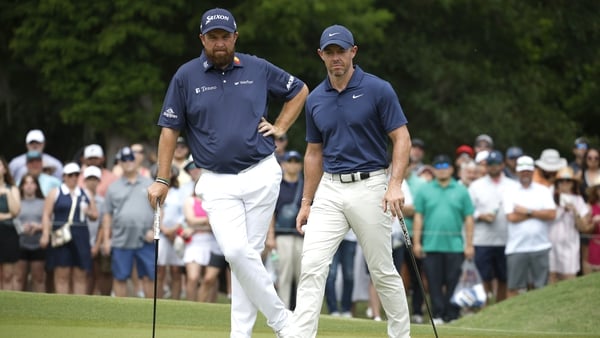 Shane Lowry and Rory McIlroy will play in the penultimate group for Sunday's final round