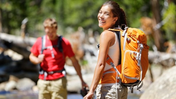 Two friends out for a hike with backpacks