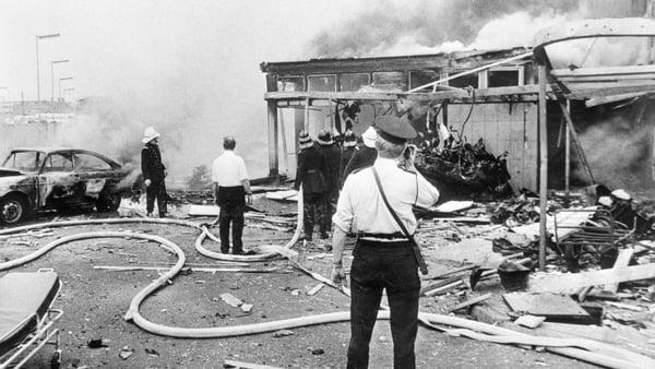 Firemen hose down the remains of Oxford Street bus station in Belfast in July 1972