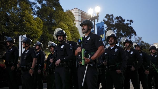 Police officers get into position as pro-Palestinian students and activists demonstrate on the campus UCLA