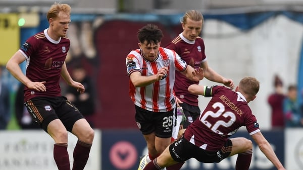 Adam O'Reilly of Derry City is tackled by Conor McCormack