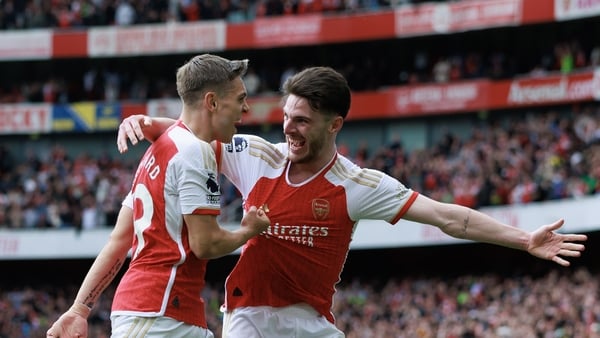 Leandro Trossard (L) celebrates with Declan Rice after scoring Arsenal's second goal