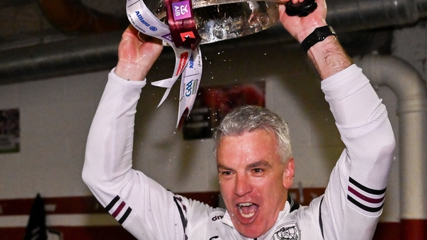 Upside down, so what: Joyce hoists the Nestor Cup in the Galway dressing room