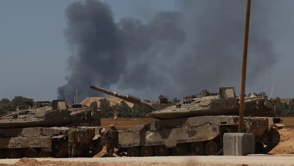 Israeli army tanks take position in southern Israel near the border with Gaza
