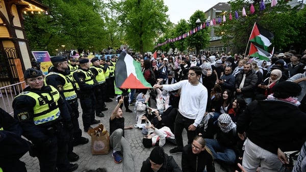 Pro-Palestinian protesters opposing Israel's Eurovision participation face a wall of police outside Eurovision Village