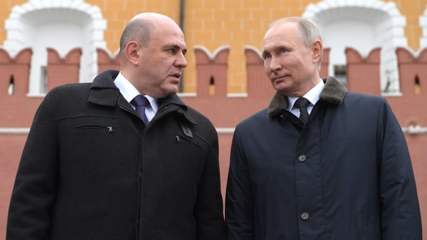 Mr Putin (R) initially appointed Mikhail Mishustin (L) as prime minister in 2020 (File image)