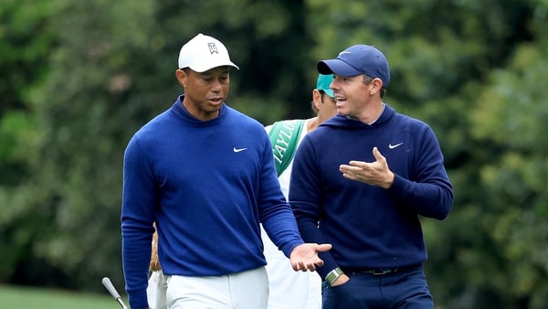Tiger Woods (L) and Rory McIlroy have been long-time friends off the course