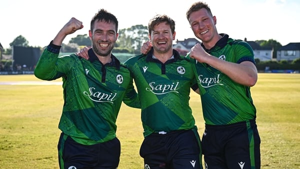 Andrew Balbirnie (L), Barry McCarthy (C) and Harry Tector celebrate after Ireland's victory