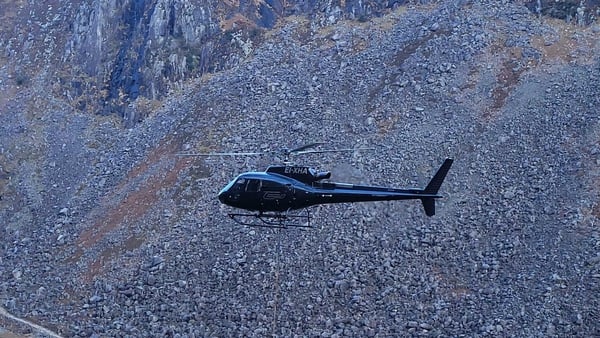Helicopter in flight over Wicklow Mountains National Park