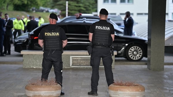 Police stand guard at the hospital where Robert Fico is receiving treatment in Slovakia
