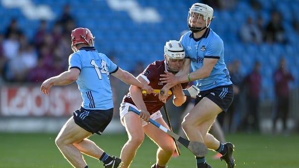 Rory Burke of Galway in action against David Purcell, right, and Neil Hogan of Dublin