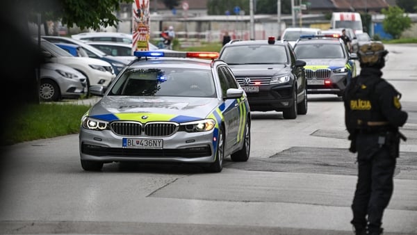 A convoy believed to carrying the shooting suspect arrives at the Specialised Criminal Court in Pezinok, north of Bratislava, Slovakia