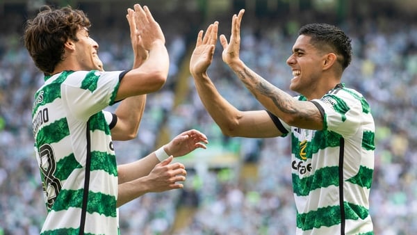 Palma (R) netted late on to wrap up Celtic's title in style