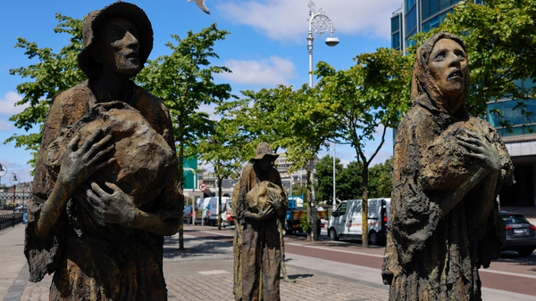 Irish sculptor Rowan Gillespie's Famine Memorial statues seen along the River Liffey in Dublin