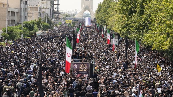 Mourners attend the funeral procession of Iran's President Ebrahim Raisi in Tehran