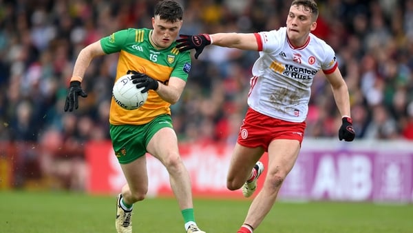 Niall O'Donnell of Donegal is tackled by Tyrone's Conn Kilpatrick in the Ulster SFC semi-final