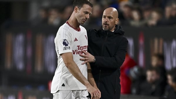 Jonny Evans (L) and Erik ten Hag