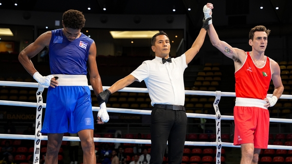 Aidan Walsh has his hand raised in victory after a stylish win over Cuba's Jorge Cuellar