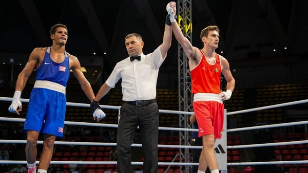 Aidan Walsh has his hand raised in victory following his box-off win in Bangkok