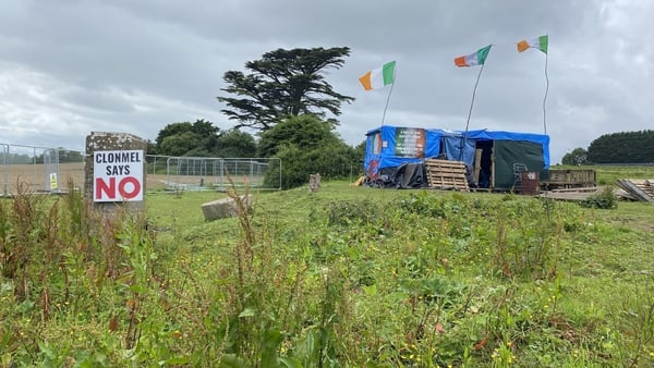 Two people occupying the 'camp' in Clonmel, Co Tipperary, declined to comment when RTÉ visited