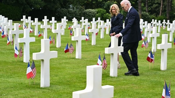 Joe and Jill Biden walk among the graves at the Normandy American Cemetery