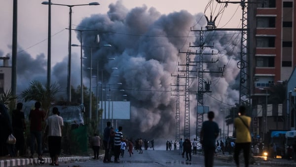 Black smoke rises over a building following Israeli attacks in Deir al-Balah, Gaza on 6 June