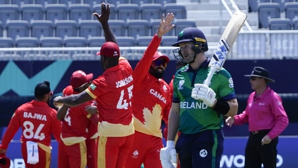 Ireland's Barry McCarthy walks away dejected as Canada celebrate their victory