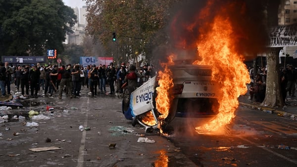 A vehicle belonging to a local media outlet is set on fire in Buenos Aires