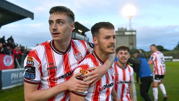 Danny Mullen celebrates with Daniel Kelly after full-time