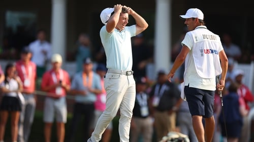 Rory McIlroy reacts after making bogey at the last hole