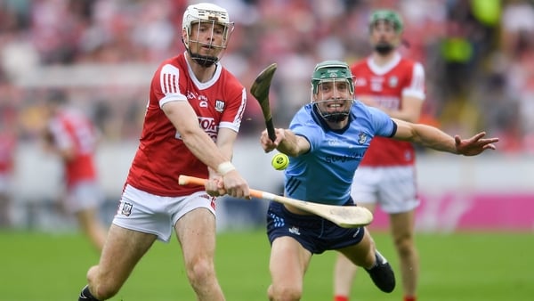 Dublin's Chris Crummey tries to challenge Cork's Luke Meade