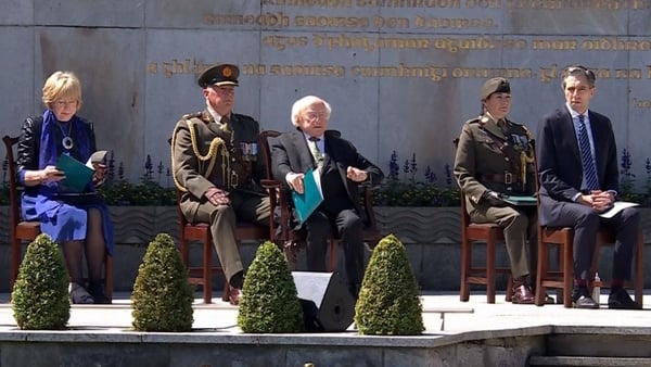 President Higgins is seen during the commemoration, alongside Taoiseach Simon Harris