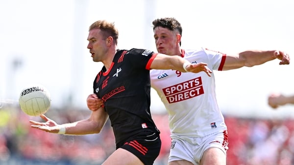 Conor Grimes of Louth in action against Colm O'Callaghan