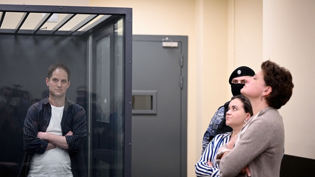 Evan Gershkovich stands inside a defendants' cage next to his lawyers at a previous hearing Evan Gershkovich stands inside a defendants' cage next to his lawyers at a previous hearing