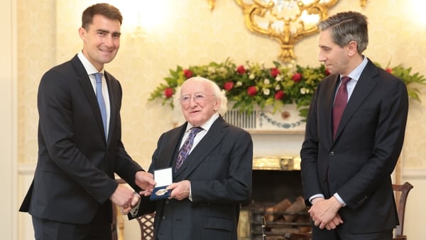 Jack Chambers pictured with the Taoiseach in Áras an Uachtaráin receiving his seal of office from President Higgins (RollingNews.ie)