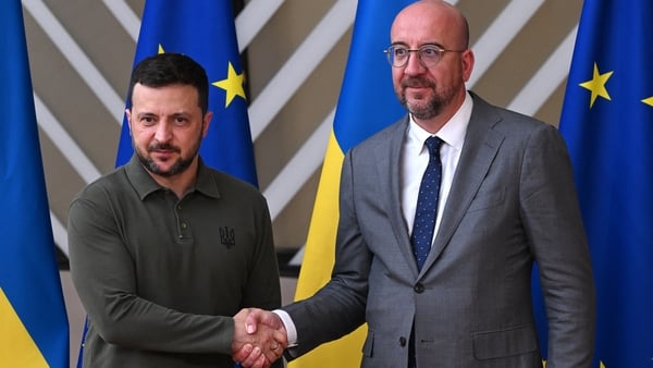 European Council President Charles Michel (R) shakes hands with Ukrainian President Volodymyr Zelensky ahead of European Council Summit at EU headquarters in Brussels