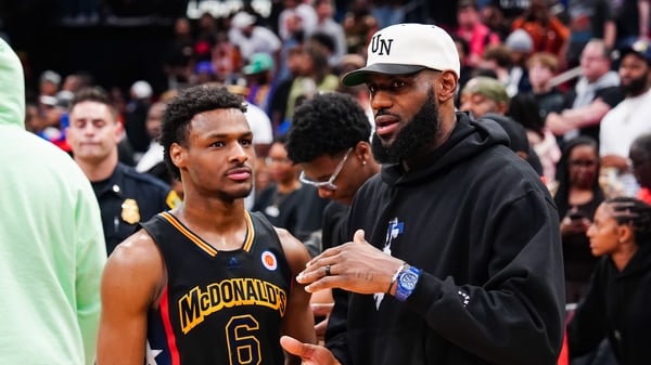 LeBron James could play alongside his son Bronny (l) if he chooses to continue his long NBA career