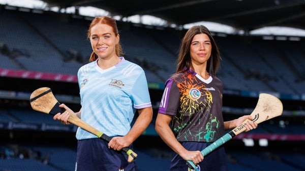 Kerrie Finnegan (L) and Dublin teammate Emma O'Byrne modelling the Camogie Association's 120th anniversary commemorative jerseys