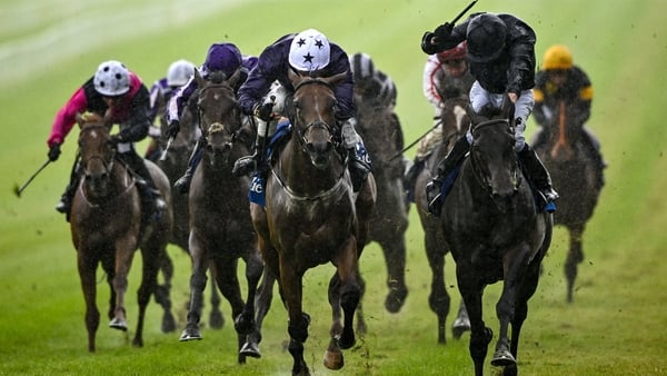 Truly Enchanting, with Ryan Moore up, right, on their way to winning the Airlie Stud Stakes